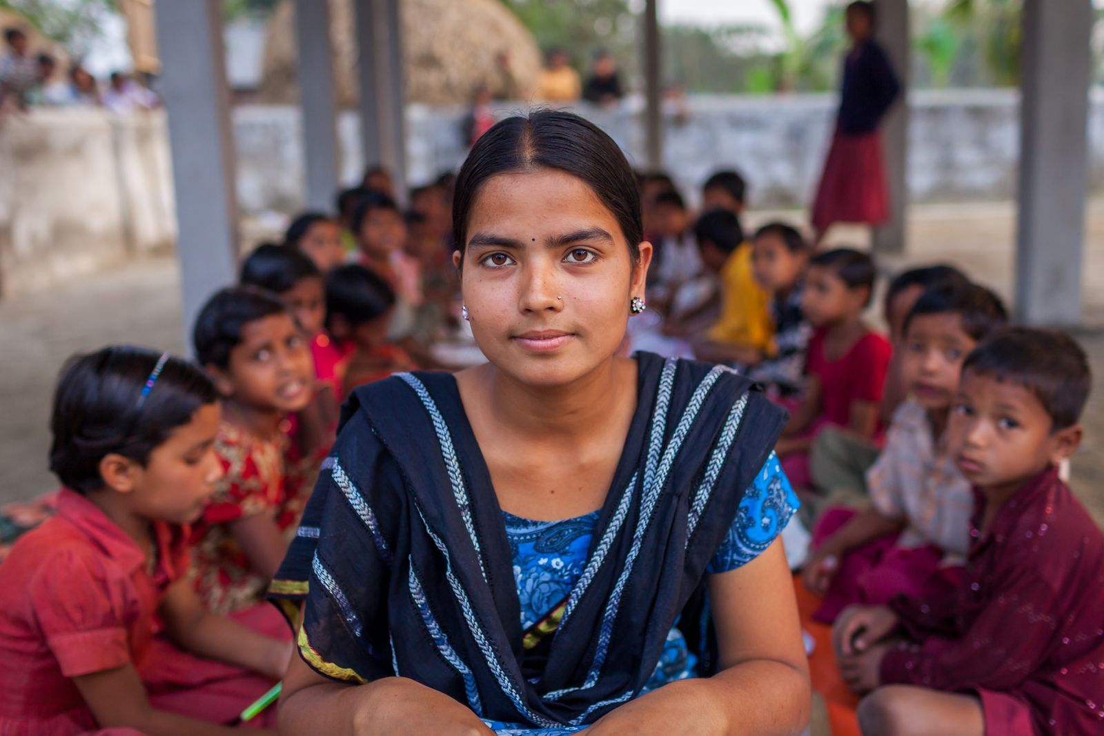 A young woman with a group of children
