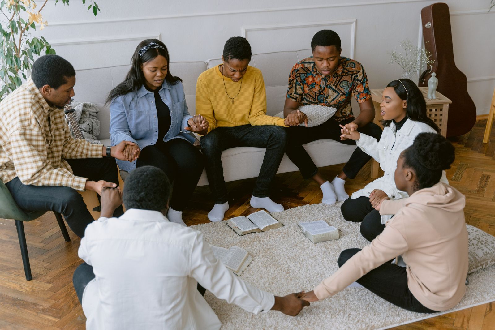People praying together in a circle